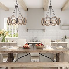 a dining room table with chairs and a bowl of fruit on the table in front of it