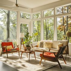 a living room filled with furniture and lots of windows