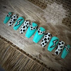 Ombre turquoise & silver cow print nails with a lightning bolt feature.  Gloss finish *Short & Long Coffin shape shown. Your new salon quality nail enhancements made by a professional nail artist, come with 10 custom nails in a box with protective packaging, detailed instructions for application & removal, cuticle pusher, wood file, buffer, alcohol wipe, nail tabs, glue & lotion spatulas. Made with Professional only products. Vegan, Cruelty & 10 free. Eco-friendly protective packaging for minima Simple Cow Print Nails, Cow Print Accent Nails, Diy Western Nails, Full Nail Designs, Western Christmas Nails Acrylic, Cowgirl Nails Designs Westerns, Nail Inspo Western, Cowgirl Nail Ideas