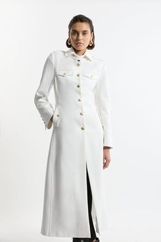 Tailored Military Maxi Coat White Outerwear With Concealed Placket And Lapel Collar, White Outerwear With Lapel Collar And Concealed Placket, Luxury White Outerwear With Concealed Placket, Designer White Outerwear With Buttons, Luxury White Outerwear With Hidden Button Closure, Luxury White Outerwear With Hidden Buttons, Fitted White Outerwear With Button Cuffs, White Fitted Outerwear With Button Cuffs, Fitted White Outerwear With Concealed Placket