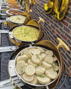 there are many different types of food on the buffet table at this party that is ready to be eaten