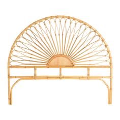 a bamboo headboard with a circular design on the top and bottom part of it