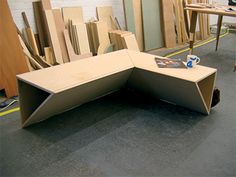 a table that has been made out of plywood and is sitting on the floor