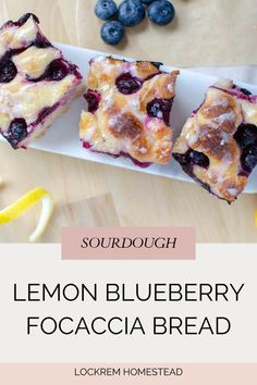 lemon blueberry focaccia bread on a white plate next to fresh blueberries