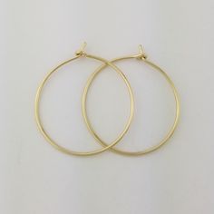 "Lovely 18 gauge, Solid 14k Gold Hoop Earrings 1.25\" size photographed; 2\" size shown in video METAL: Solid 14k Yellow Gold WIRE GAUGE/DIAMETER: 18 gauge (1.0mm) wire - Slightly thicker than standard ear wire thickness EARRING DIAMETER SIZE: Approximately 3/4\", 1\", 1.25\" (Pictured), 1.5\", 1.75\", 2\", 2.25\", 2.5\" -OR- 3\" diameter. Choose the size that is right for you! NOTE: Please review all listing photos, ArisDesignsJewelry Policies and FAQ sections prior to purchase. Find the full s Classic Brass Hoop Earrings As Gift, Handmade Yellow Gold Hoop Earrings, Handmade Classic Yellow Gold Hoop Earrings, Small Hoop Yellow Gold Earrings As Gift, Yellow Gold Hoop Earrings With Ear Wire As Gift, Yellow Gold Hoop Earrings Gift, Nickel Free Yellow Gold Hoop Earrings For Wedding, Real Gold Hoop Earrings, Saint Helens