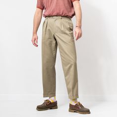 "Vintage 90's St Michael men's formal pants in camel-beige - high waist - 4 pockets - belt loops - zip fly - materials: 50% cotton, 50% polyester SIZE size from label: waist 32\" (81 cm), inside leg 29\" (74 cm) best fits men: M MEASUREMENTS waist: 32 inches (81 cm) hips: 44 inches (112 cm) rise: 12 inches (30 cm) length: 39.5 inches (100 cm) inseam: 29 inches (74 cm) The model is 6'1\" (186 cm), measures 41-35-39 (104-88-100 cm) CONDITION: 9/10 - The pants in great vintage condition. Washed, re Khaki Chinos With Belt Loops Straight Fit, Khaki Chinos With Belt Loops, Beige Tapered Leg Chinos With Belt Loops, Brown Pleated Cotton Bottoms, Classic Khaki Cargo Pants With Belt Loops, Beige Chino Cotton Twill Bottoms With Belt Loops, Beige Straight Chinos With Belt Loops, Classic Khaki Chinos With Belt Loops, Beige Tapered Leg Work Pants With Belt Loops