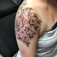 a woman's arm with flowers on it