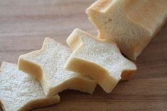 slices of bread sitting on top of a wooden table