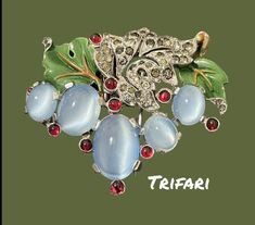 "Vintage Trifari Alfred Philippe Jelly belly moonstone cabochon, enamel leaves and rhinestones fur clip 2\"by 11/2\" Good vintage condition" Moonstone Cabochon, Trifari Jewelry, Vintage Trifari, Jelly Belly, 1950s Vintage, Vintage Costume Jewelry, Vintage Costumes, Last Minute Gifts, Matching Earrings