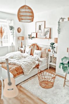 a bed room with a neatly made bed and lots of plants on the wall next to it