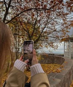 a woman taking a photo with her cell phone