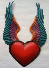 a red heart with wings hanging from it's side