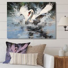 a white swan splashing water in a living room