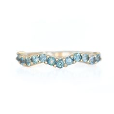 a gold ring with blue stones on it