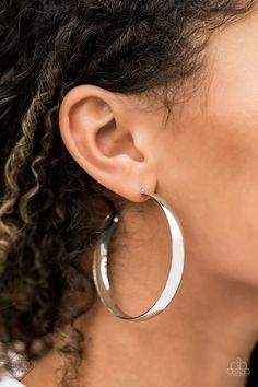 Brushed in a high sheen finish, a thick silver hoop curls around the ear in a classic metallic finish. Earring attaches to a standard post fitting. Hoop measures approximately 2 1/4" in diameter. Sold as one pair of hoop earrings. Complete the Look! Search in "Fashion Fix" tab for: Necklace: "Powerhouse Prowl" Thick Hoop Earrings, Hoop Earrings Style, Jewelry Catalog, Bar Stud Earrings, Bar Studs, Paparazzi Accessories, Silver Bars, Paparazzi Jewelry, Silver Drop Earrings