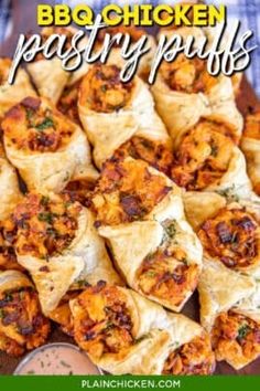 bbq chicken pastry puffs on a platter with dipping sauce in the background