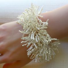 About this item-- Expertly crafted from white and silver seed beads, this fringe bracelet brings a playful touch to any outfit! The delicate fringe detailing is both whimsical and stylish, making it the perfect accessory for any special occasion. One-of-a-kind piece available in only one size. Please take a moment to check the measurements to ensure a perfect fit. Specs-- Measurement: length - 165 mm (6.5 inches) width - 25 mm (1 inches) Material: Color: Clear/silver/white/rose gold Hardware: box clasp Weight: 2 grams Production ID: BR005 White Tiny Beads Bracelets For Wedding, White Tiny Beads Bracelet For Wedding, White Beaded Bracelets With Tiny Beads For Party, White Beaded Bracelets With Spacer Beads For Wedding, White Beaded Bracelets With Tiny Beads For Wedding, Handmade White Beaded Bracelets For Party, Bohemian White Bracelets With Silver Beads, White Adjustable Beaded Bracelets For Parties, Adjustable White Beaded Bracelets For Party