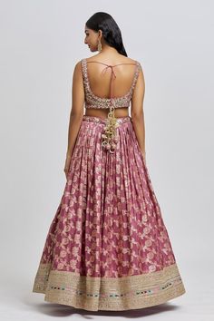 Mauve attached cancan lehenga with all over floral pattern and golden embroidered hem. Paired with a padded blouse with all over embroidery using beads, mirror, zari, sequin and cutdana work and dupatta. - Aza Fashions Traditional Wear With Floral Embroidery In Brocade For Reception, Floral Embroidered Brocade Lehenga, Brocade Lehenga With Floral Embroidery For Wedding, Brocade Sets With Floral Embroidery For Reception, Fitted Brocade Lehenga With Floral Embroidery, Wedding Lehenga With Floral Embroidery In Brocade, Fitted Brocade Sets With Floral Embroidery, Anarkali Style Brocade Lehenga With Floral Embroidery, Festive Brocade Lehenga With Floral Embroidery