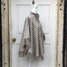 This Beautiful Hand Embroidered pullover poncho is perfect for keeping you stylish during those breezy sunny days. It has gorgeous hand embroidered details from top to bottom. Same design back and front. MADE IN MEXICO By: Mexican Artisans For: Women Size: One Size Color: off-white | gray Measurements: Neck to end: 24" Shoulder to shoulder: 40.5" All ponchos are measured lying flat, not stretched but relaxed. All measurements are inches Details: 100% cotton Pullover poncho Toggle closure Tassels Embroidered Pullover, Embroidered Details, Cotton Pullover, Clothes Pins, Ponchos, Beautiful Hand, Sunny Days, Hand Embroidered, Tassels