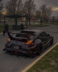 a black sports car parked on the side of the road