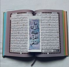 an open book with arabic writing on it