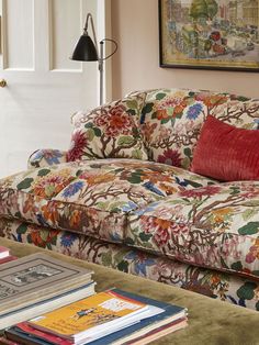 a living room filled with furniture and books