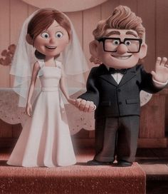 a cartoon image of a bride and groom standing on a stage with their hands in the air