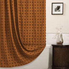 a bath room with a toilet and a shower curtain