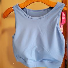 Crop Tank With Padded Bra Casual Blue Stretch Crop Top, Blue Workout Tops For Spring, Trendy Blue Sports Crop Top, Spring Blue Workout Tops, Blue Athleisure Crop Top For Summer, Blue Athleisure Tops For Spring, Trendy Blue Crop Top For Workout, Light Blue Stretch Casual Tank Top, Casual Light Blue Stretch Tank Top