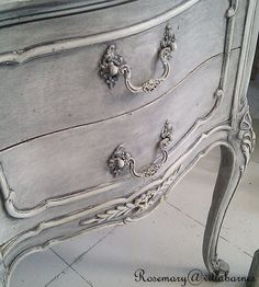 an antique dresser with ornate handles and knobs on it's drawers is shown