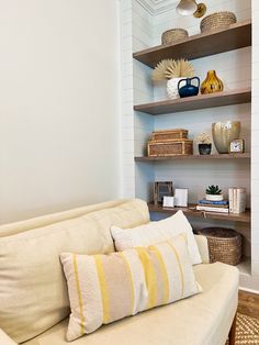 a living room filled with furniture and shelves