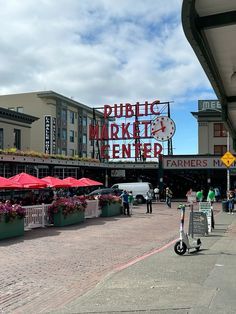 a public market center with people walking around