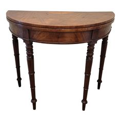 an oval wooden table with two legs and a drawer on the top, against a white background