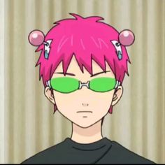 a person with pink hair and green glasses