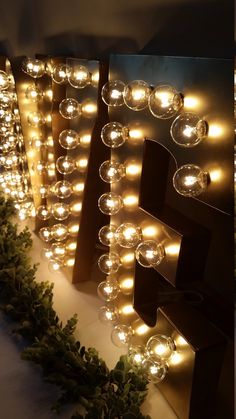 some lights that are on the side of a wall