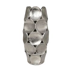 a silver vase sitting on top of a white surface