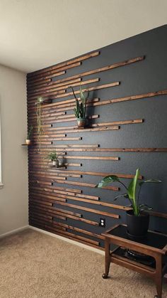 a living room with some plants on the wall