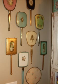 there are many different types of spoons hanging on the wall