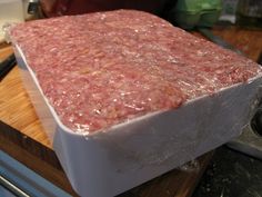 raw ground meat sitting on top of a cutting board