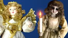 two angel figurines one holding a lit candle and the other wearing a gold dress