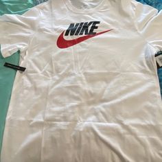 The Nike Tee Size Xl Standard Fit White With Original Nike Logo Blk&Red Summer Wear White Crew Neck Shirt With Logo Print, Casual White Shirt With Branding, Nike White Cotton Shirt, Casual White Shirt For Sports, Basic White Shirt With Logo Print, Nike White T-shirt With Letter Print, Casual White Tops With Branding, Casual White Top With Branding, White Branded Sports T-shirt