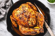 a roasted chicken in a cast iron skillet