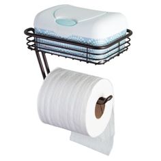 two rolls of toilet paper are sitting on a rack next to a roll of toilet paper