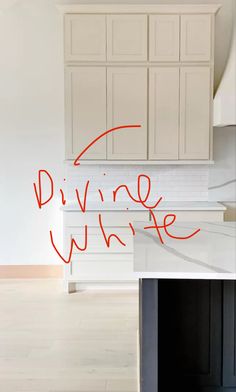 a kitchen with white cabinets and red writing on the wall that says, dive whirf