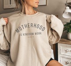 Embrace your role as a mother with our soft and comfy cotton blend sweatshirt. This sweatshirt is designed with a gender neutral fit so it fits a bit relaxed. Size up for that trendy oversized fit and please refer to our size chart before ordering! :) Also available as a tshirt: https://goldenlighttees.etsy.com/listing/1706122521 long sleeve shirt: https://goldenlighttees.etsy.com/listing/1808460403 hoodie: https://goldenlighttees.etsy.com/listing/1778046368 We do direct-to-garment printing on o Bible Mom Shirt, So God Made A Mom Shirt, Christian Crewneck, Mama Shirts, Presents For Mom, Homeschool Mom, Mama Shirt, Christian Shirts, Mom Shirt