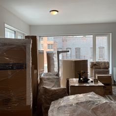 boxes are piled up in an empty room