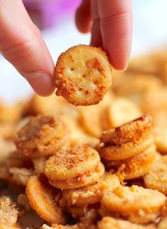 a person is dipping crackers into some food