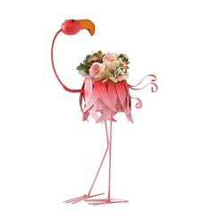 a pink flamingo holding a bouquet of flowers