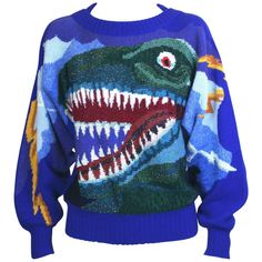 Wonderful Krizia Collectible Dinosaur Sweater, Amazing intarsia design with dozens of different yarns (metallic, matte, fuzzy) combine to make this ferocious graphic of T Rex with golden lighting bolds running down the deep bat wing sleeves, Wool knit base with a bevy a different yarns used to create this wonderful knitted "painting". Wonderfully collectible piece from the famed Krizia Animal Series. 1980's Italy. Size 40 Italian. 70% wool, 20% angora, 10% rayon. Excellent condition. L Dinosaur Sweater Women, Knit Kitsch Sweater Pattern, Knitted Bat Wing Sweater Pattern, Dinosaur Sweater Vest, Fun Sweaters Knit, Unif Pixie Sweater, Cute Dino Sweater, Dino Sweater Crochet, Dinosaur Knitting Sweater