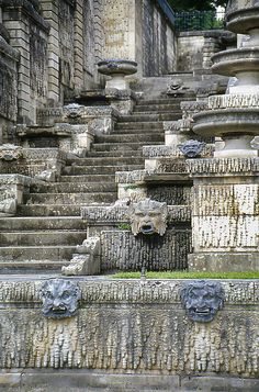 some stone steps with heads on them